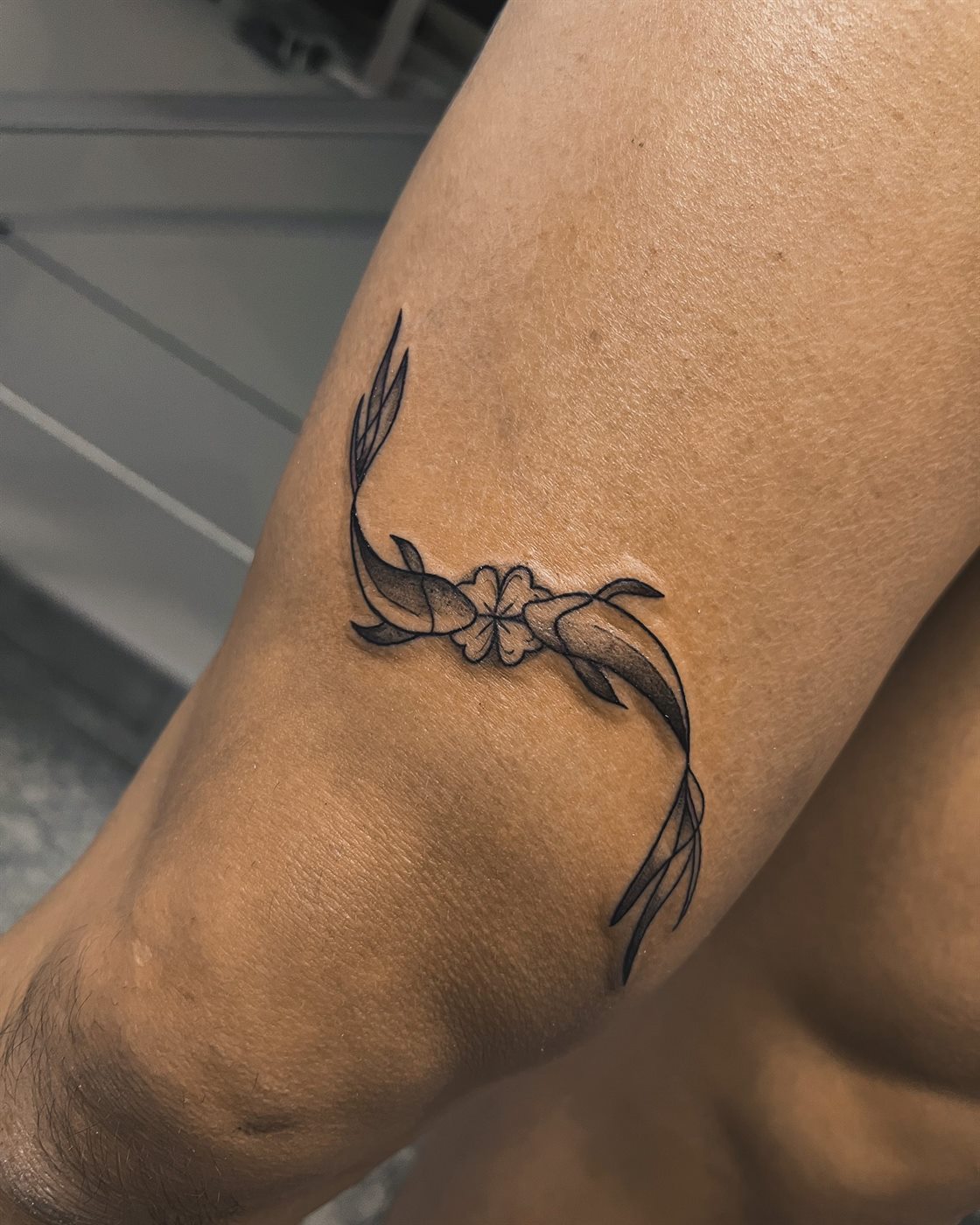 Fine line floral tattoo