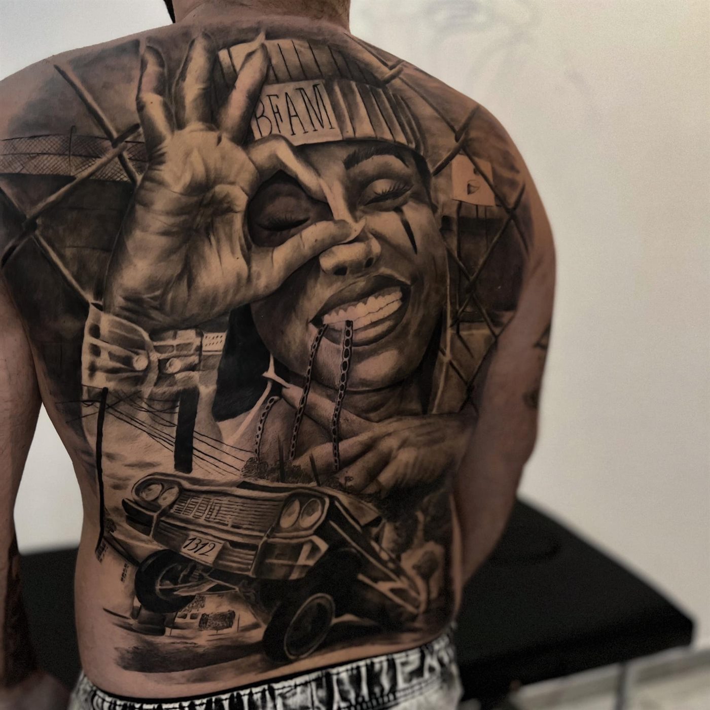 Large black and grey back piece tattoo